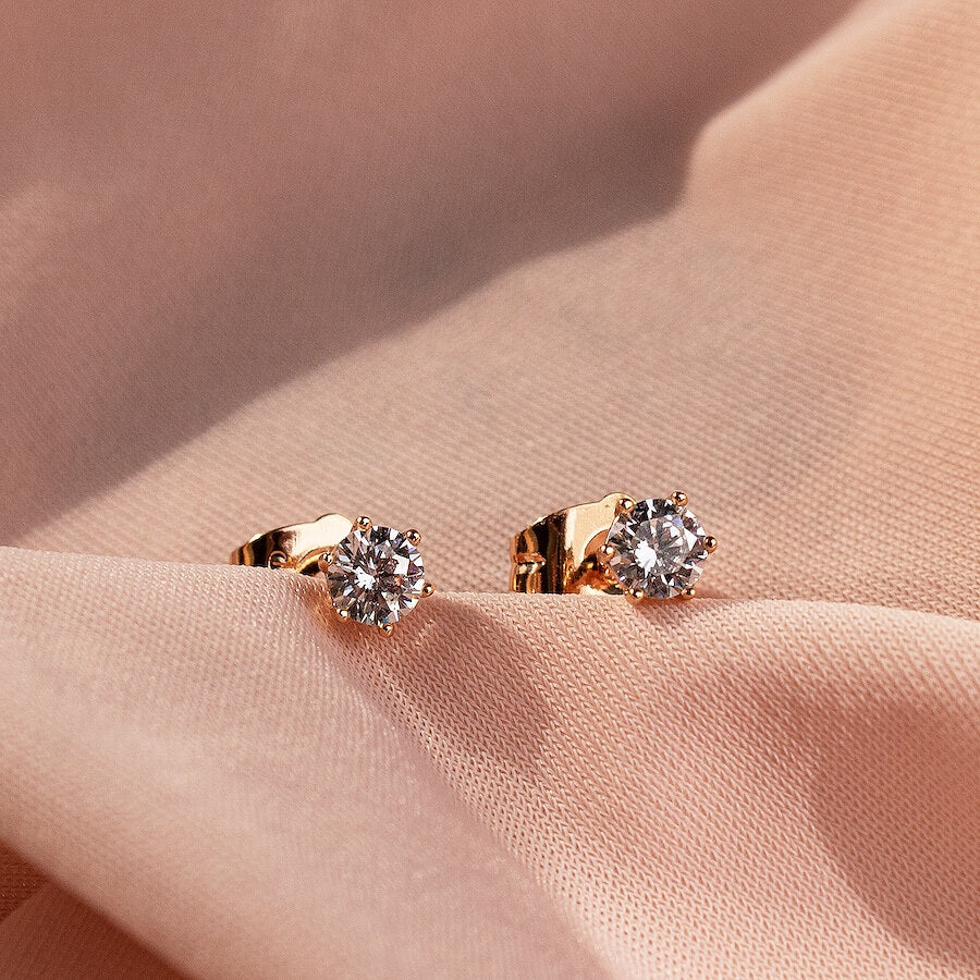 Apzeltītu auskari ar maziem kristāliem